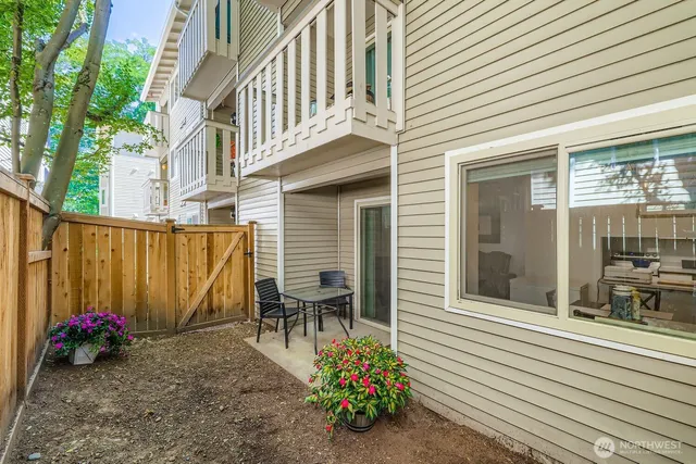 a view of a dinning tables and chairs in patio of the house