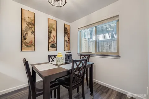 a view of a dining room with furniture and window