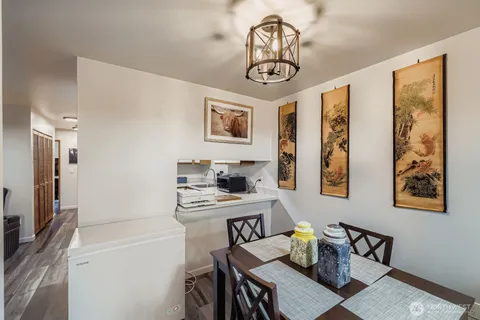 a view of a dining room with furniture window and wooden floor