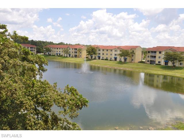 8284 Key Royal Circle, Unit 1332 Naples, FL 34119 - Photo 12 of 13 a view of a lake with a city