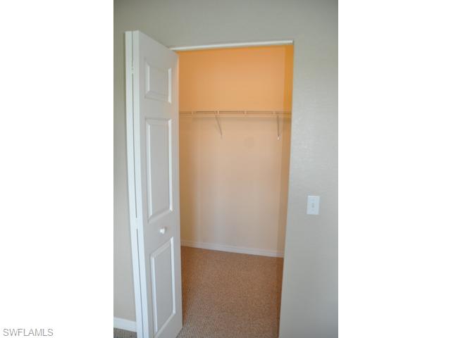 8284 Key Royal Circle, Unit 1332 Naples, FL 34119 - Photo 13 of 13 a picture of a room with a door