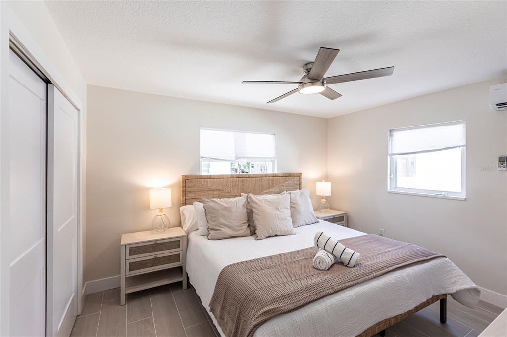 6020 Midnight Pass Road, Unit 15 Sarasota, FL 34242 - Photo 11 of 19 a bedroom with a bed and a window