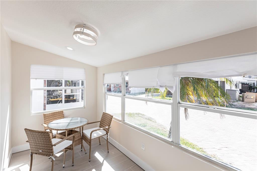 6020 Midnight Pass Road, Unit 15 Sarasota, FL 34242 - Photo 2 of 19 a view of a dining room with furniture window and outside view
