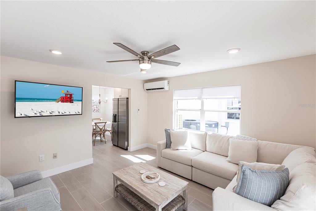 6020 Midnight Pass Road, Unit 15 Sarasota, FL 34242 - Photo 3 of 19 a living room with furniture and a window