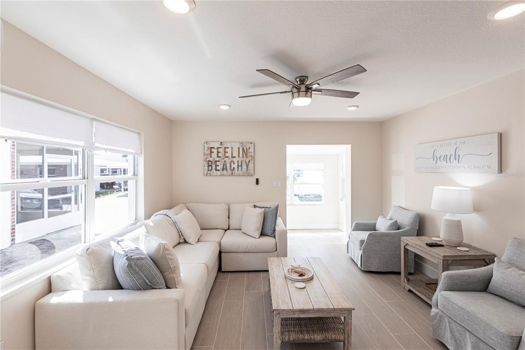 6020 Midnight Pass Road, Unit 15 Sarasota, FL 34242 - Photo 5 of 19 a living room with furniture and a large window