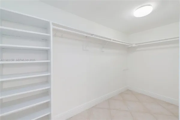 a view of an empty walk in closet