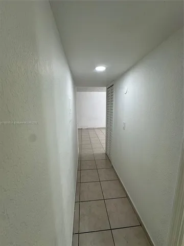 a view of hallway with a window