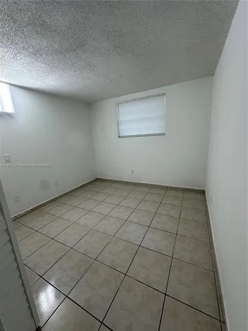 an empty room with a bench