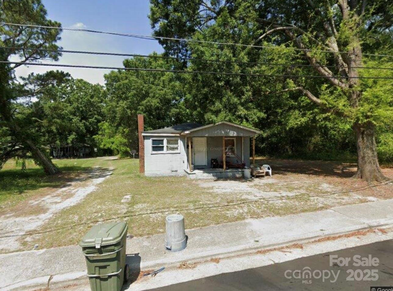 114 Hood Street Rockingham, NC 28379 - Photo 1 of 1 a front view of a house with a yard