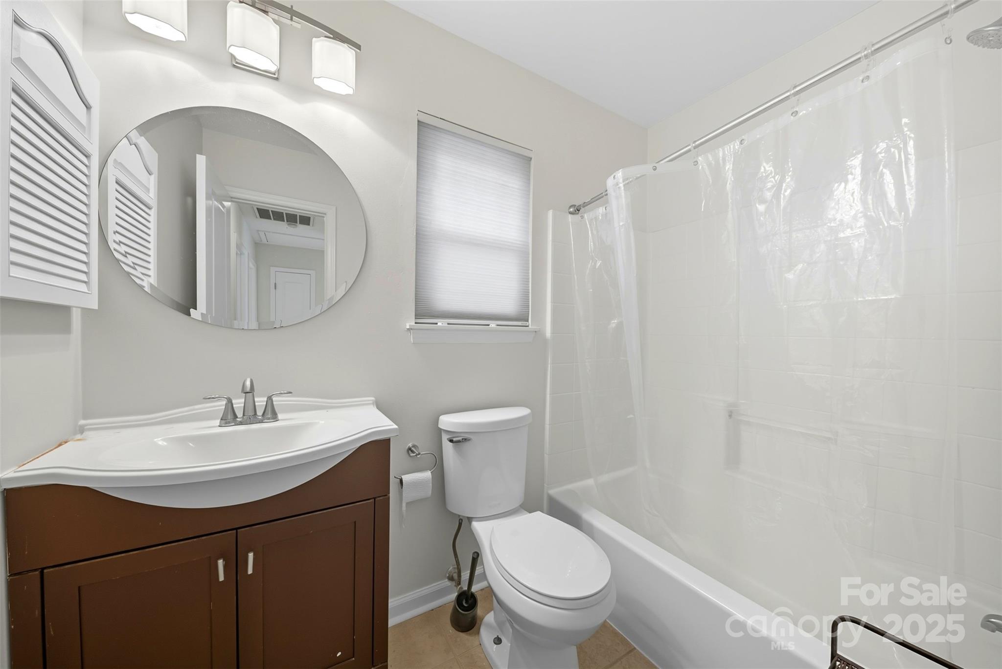 13308 Bolingbrook Lane Charlotte, NC 28273 - Photo 22 of 34 a bathroom with a sink a toilet and a mirror