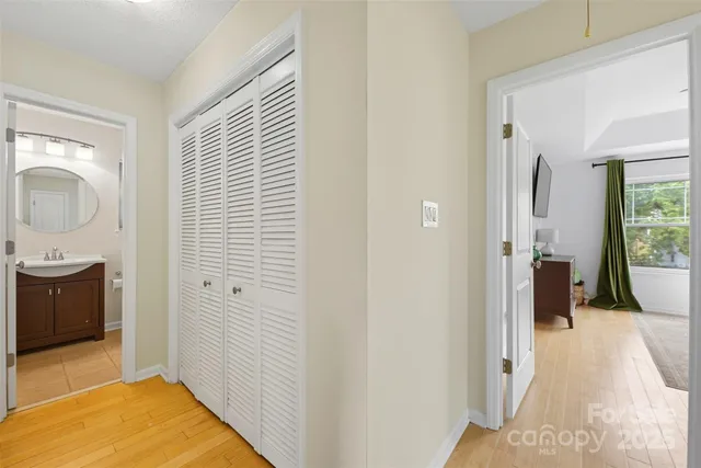 a view of a bathroom with sink and mirror