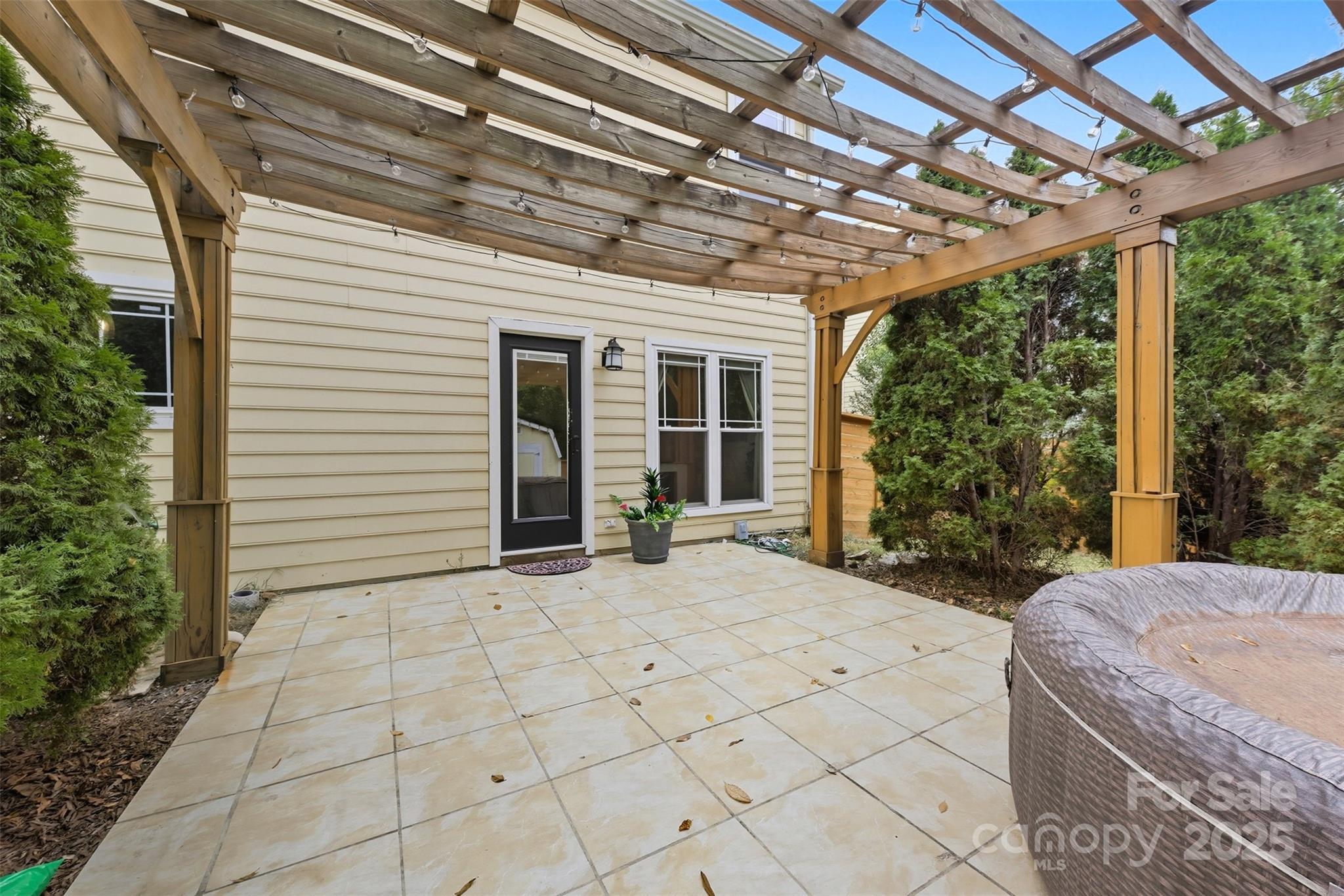 13308 Bolingbrook Lane Charlotte, NC 28273 - Photo 24 of 34 a view of a porch with furniture and garden
