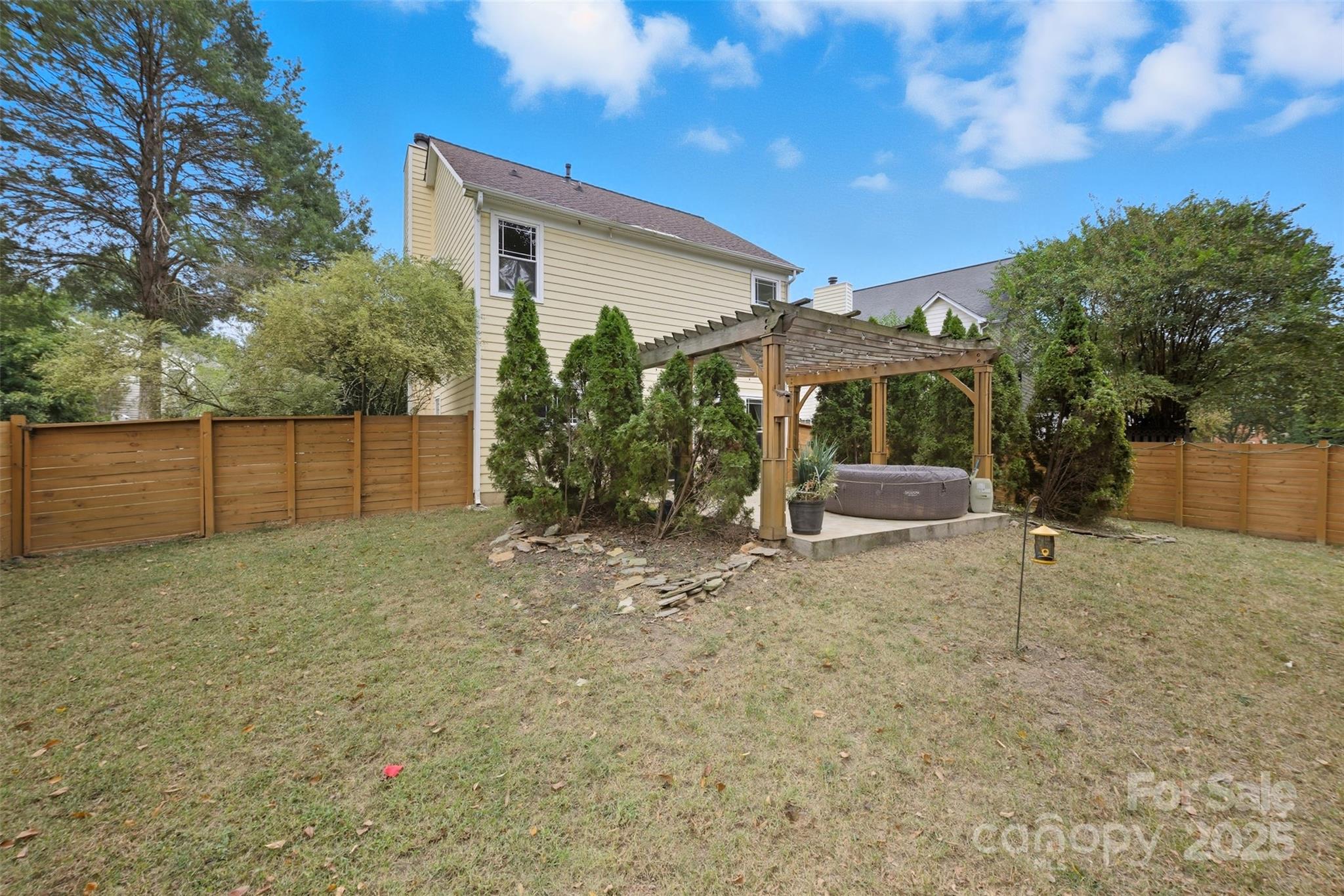13308 Bolingbrook Lane Charlotte, NC 28273 - Photo 25 of 34 a view of a house with backyard and a tree