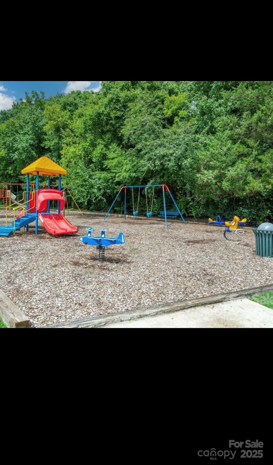 13308 Bolingbrook Lane Charlotte, NC 28273 - Photo 34 of 34 a view of outdoor space with playground and green space