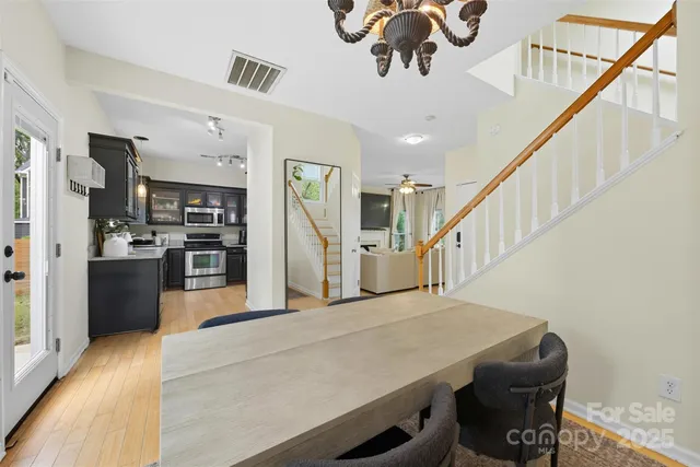 a view of a livingroom with kitchen and furniture