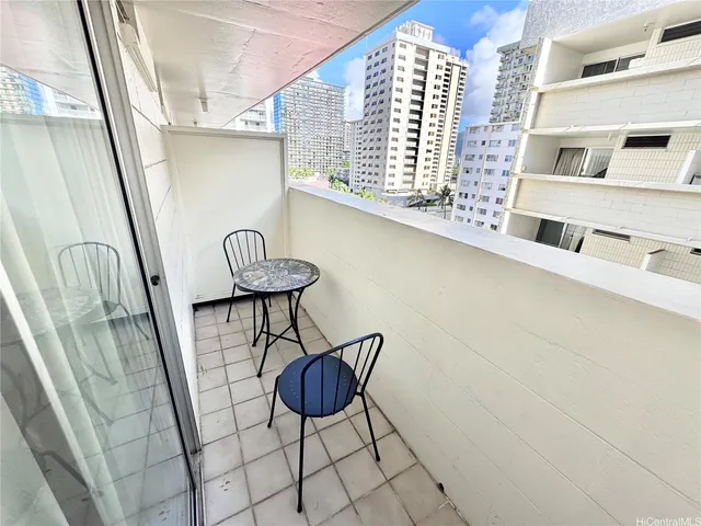a view of a hallway with seating space