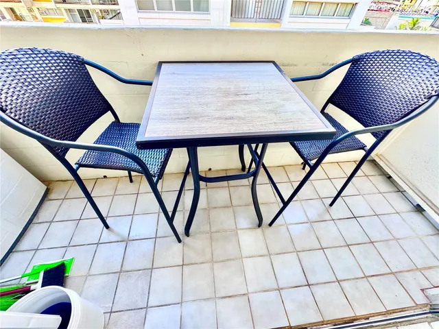 a view of a balcony furniture and window