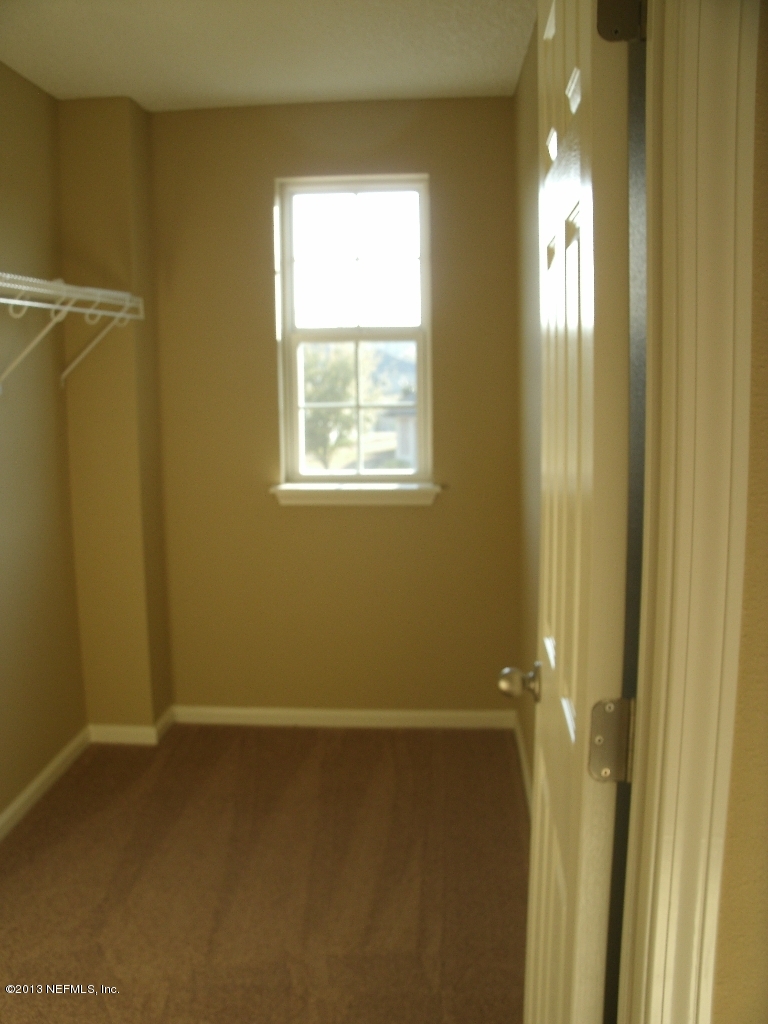 787 East Red House Branch Road St. Augustine, FL 32084 - Photo 23 of 29 a view of an empty room and window