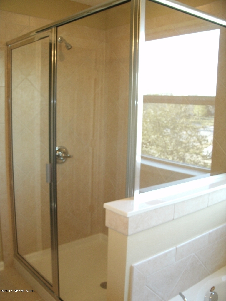 787 East Red House Branch Road St. Augustine, FL 32084 - Photo 24 of 29 a bathroom with a shower and a view of bathroom