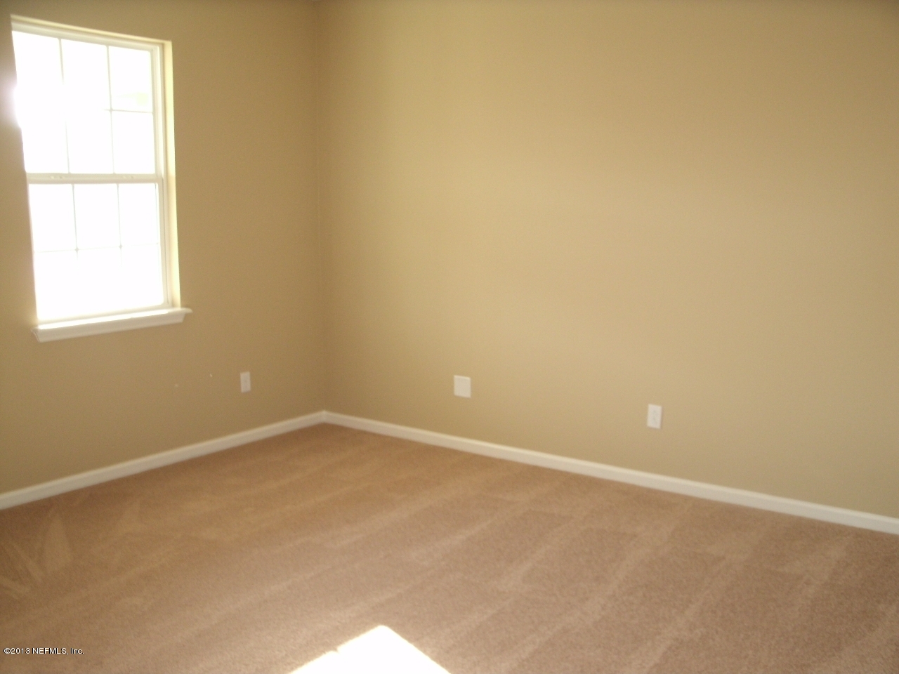 787 East Red House Branch Road St. Augustine, FL 32084 - Photo 9 of 29 an empty room with a window