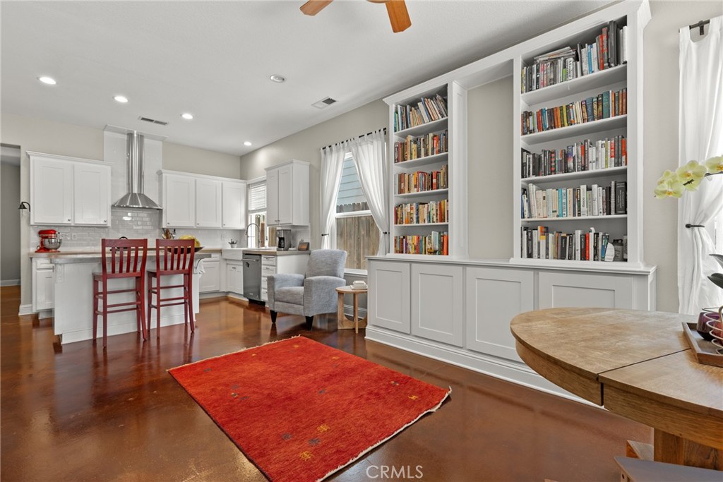 331 Weymouth Way Chico, CA 95973 - Photo 12 of 26 a living room with furniture a table and a book shelf