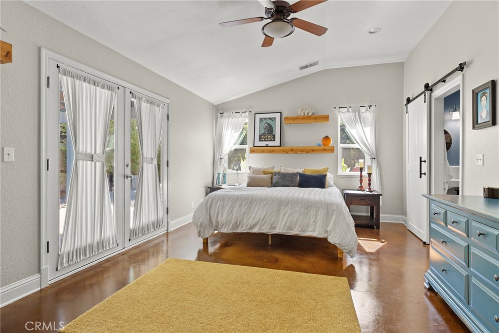 331 Weymouth Way Chico, CA 95973 - Photo 13 of 26 a bedroom with a bed and a chandelier