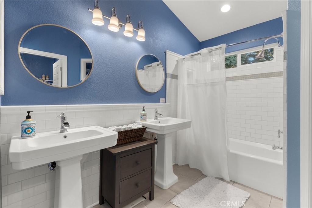 331 Weymouth Way Chico, CA 95973 - Photo 14 of 26 a bathroom with a sink and a mirror