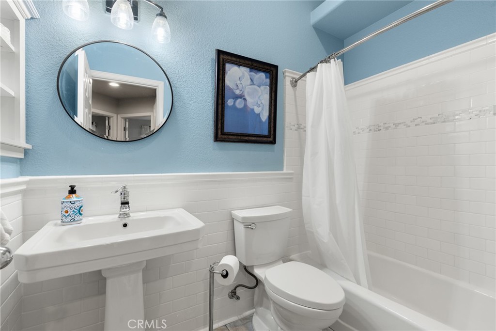 331 Weymouth Way Chico, CA 95973 - Photo 17 of 26 a bathroom with a toilet a sink and mirror