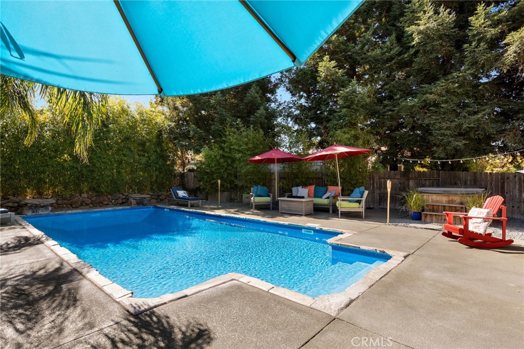 331 Weymouth Way Chico, CA 95973 - Photo 24 of 26 a view of a swimming pool with chairs in patio