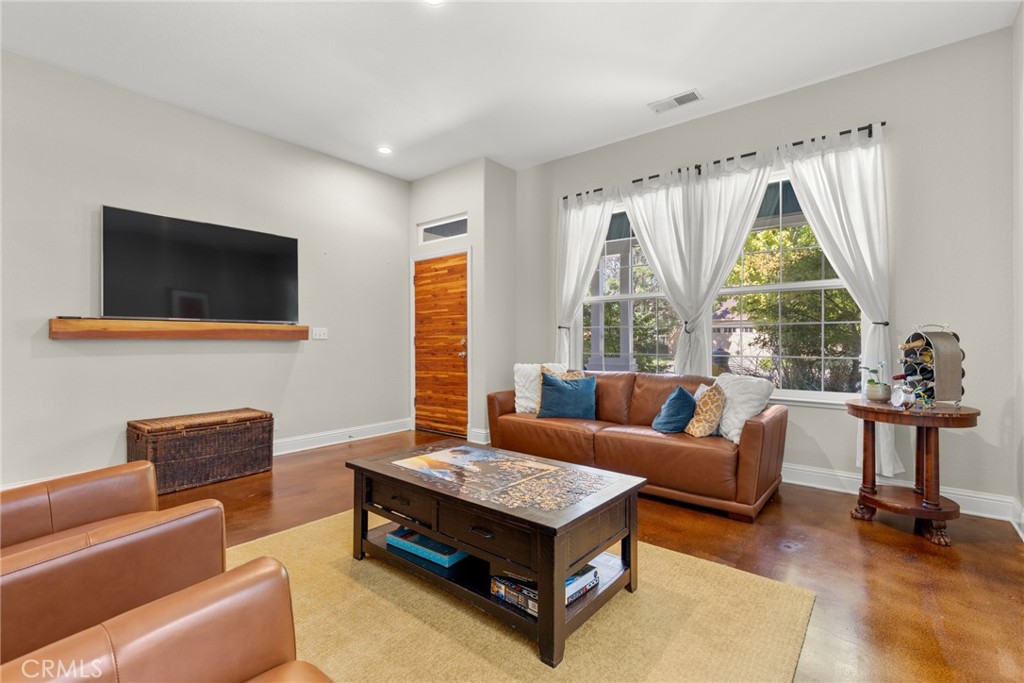 331 Weymouth Way Chico, CA 95973 - Photo 4 of 26 a living room with furniture and a flat screen tv