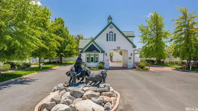 a view of a house with swimming pool and sitting area