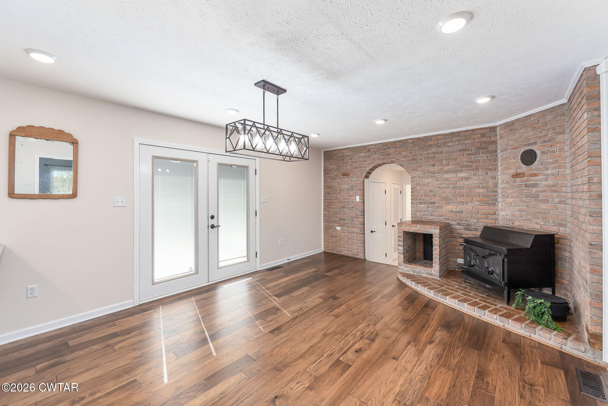 105 Center Hill-Wright Road Reagan, TN 38368 - Photo 14 of 54 a view of a livingroom with a fireplace wooden floor and staircase