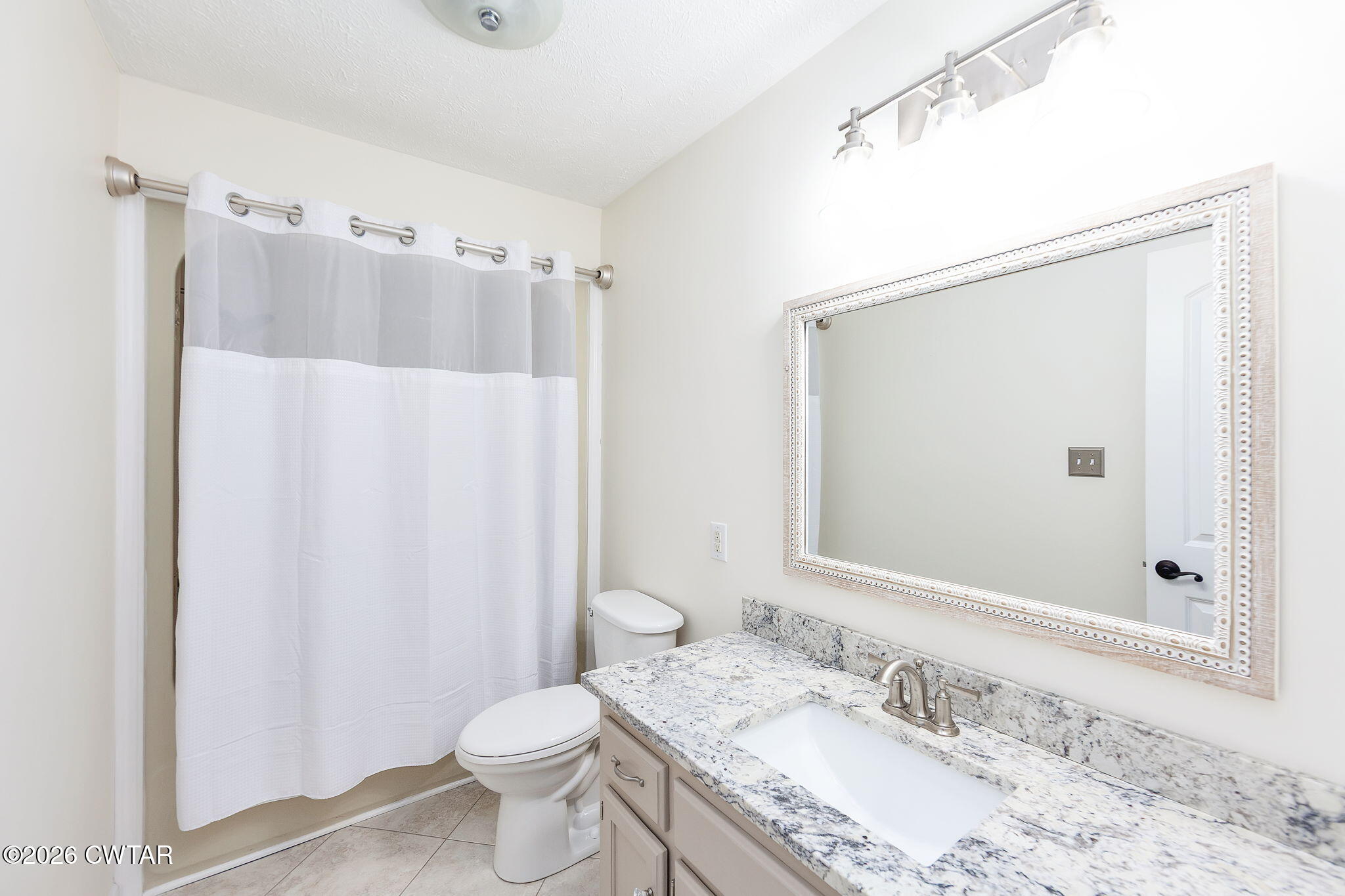 105 Center Hill-Wright Road Reagan, TN 38368 - Photo 17 of 54 a bathroom with a granite countertop sink toilet and shower