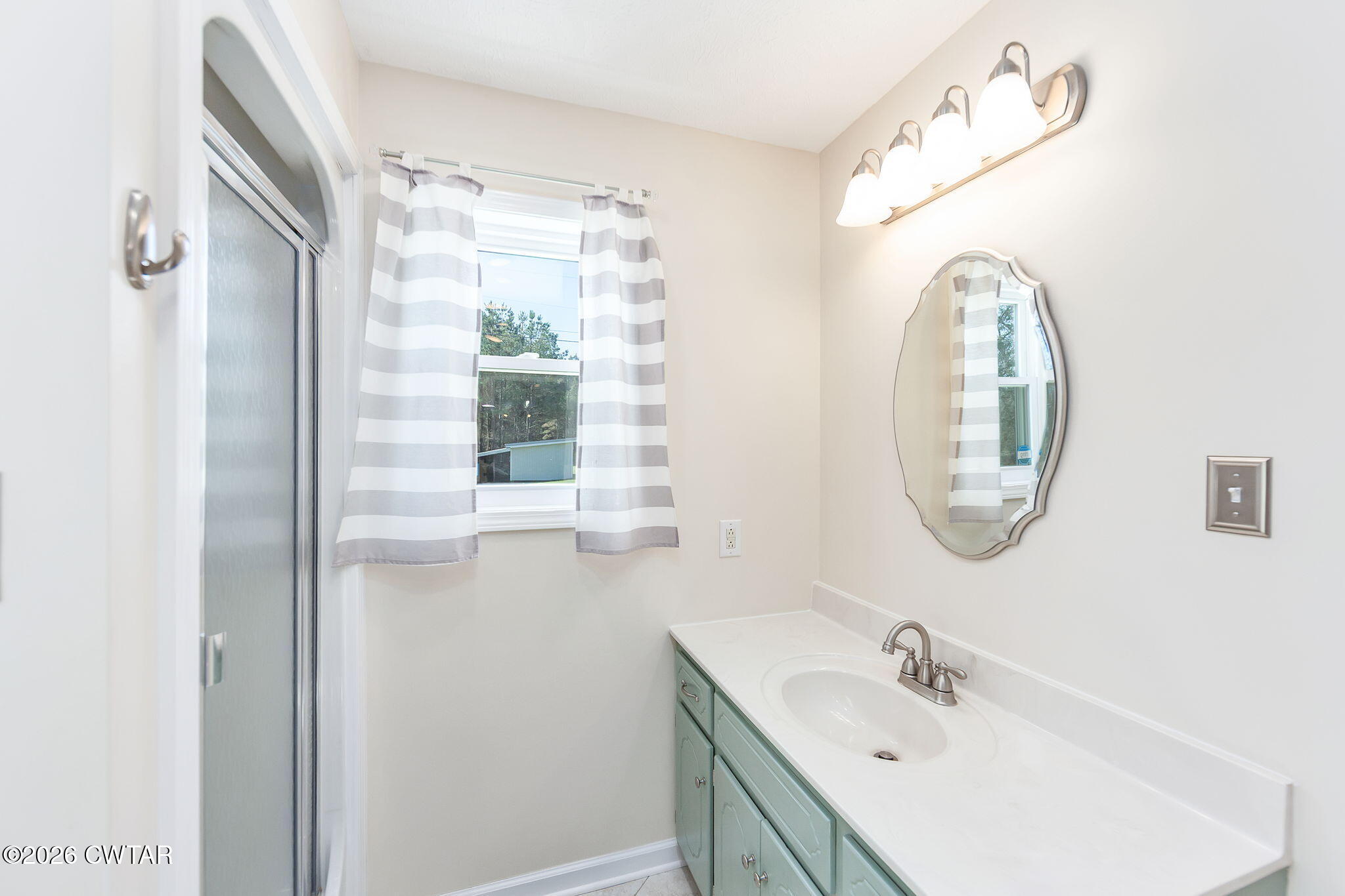 105 Center Hill-Wright Road Reagan, TN 38368 - Photo 19 of 54 a bathroom with a sink and a mirror