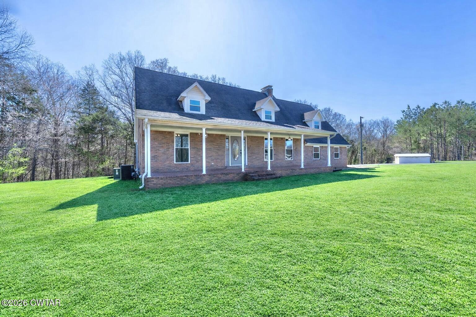 105 Center Hill-Wright Road Reagan, TN 38368 - Photo 3 of 54 a view of a house with a backyard