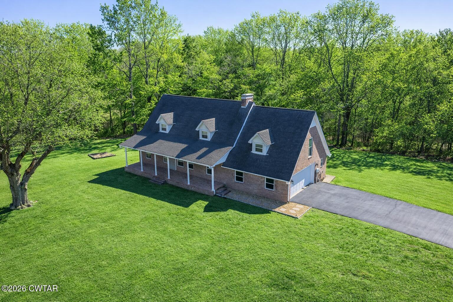 105 Center Hill-Wright Road Reagan, TN 38368 - Photo 31 of 54 an aerial view of a house with a yard table and chairs