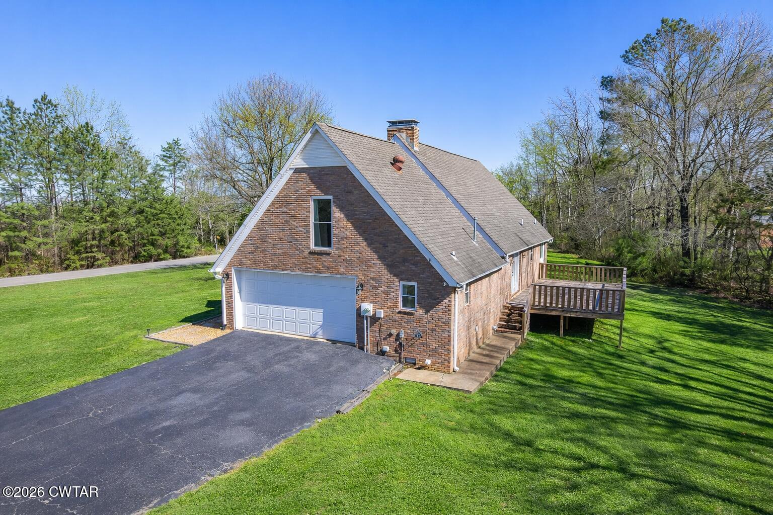 105 Center Hill-Wright Road Reagan, TN 38368 - Photo 40 of 54 a view of a house with a yard and deck