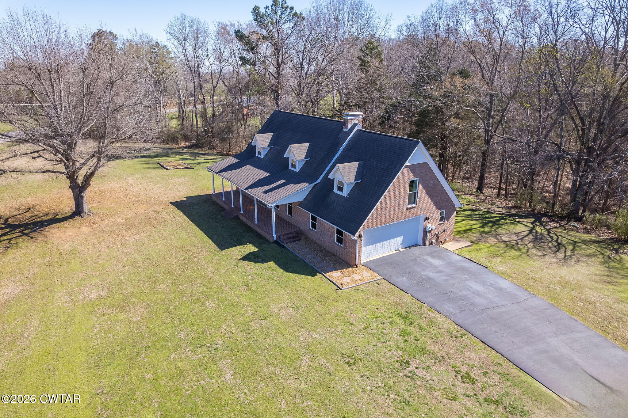 105 Center Hill-Wright Road Reagan, TN 38368 - Photo 47 of 54 a view of a house with a yard covered in snow