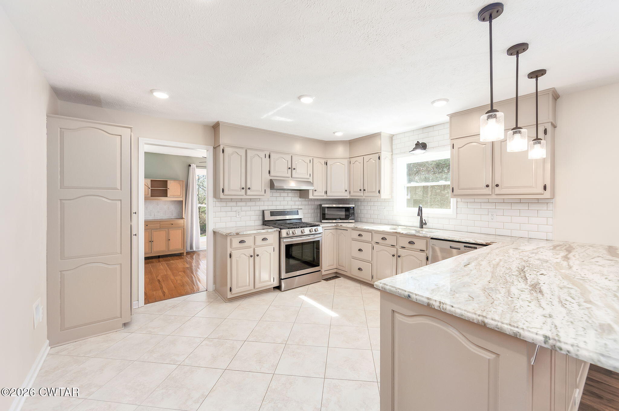 105 Center Hill-Wright Road Reagan, TN 38368 - Photo 8 of 54 a kitchen with a stove a sink and a refrigerator