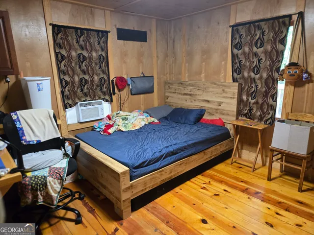 a bathroom with a sink a toilet and shower curtain