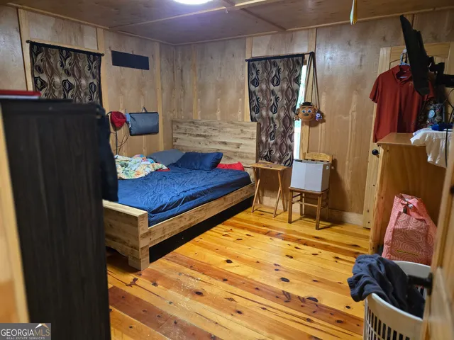 a bedroom with a bed and a closet