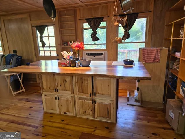 a kitchen with kitchen island a stove a sink and a refrigerator