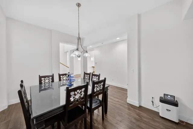 a kitchen with refrigerator and cabinets