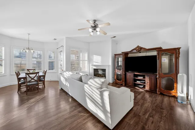 a bedroom with furniture and a wooden floor