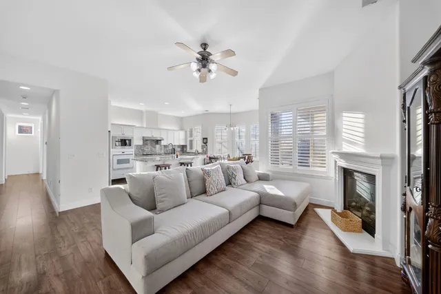 a bedroom with furniture and wooden floor