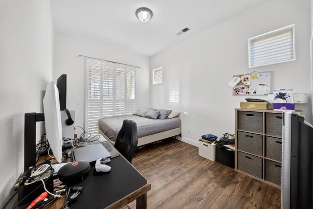 a view of hallway with wooden floor