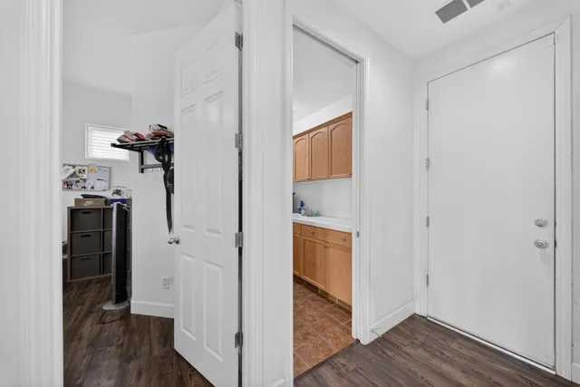 a bedroom with a bed and windows