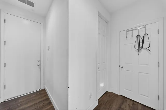 a large bathroom with a large tub and double vanity