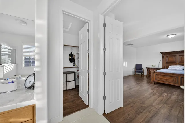 a view of a patio with table and chairs and potted plants