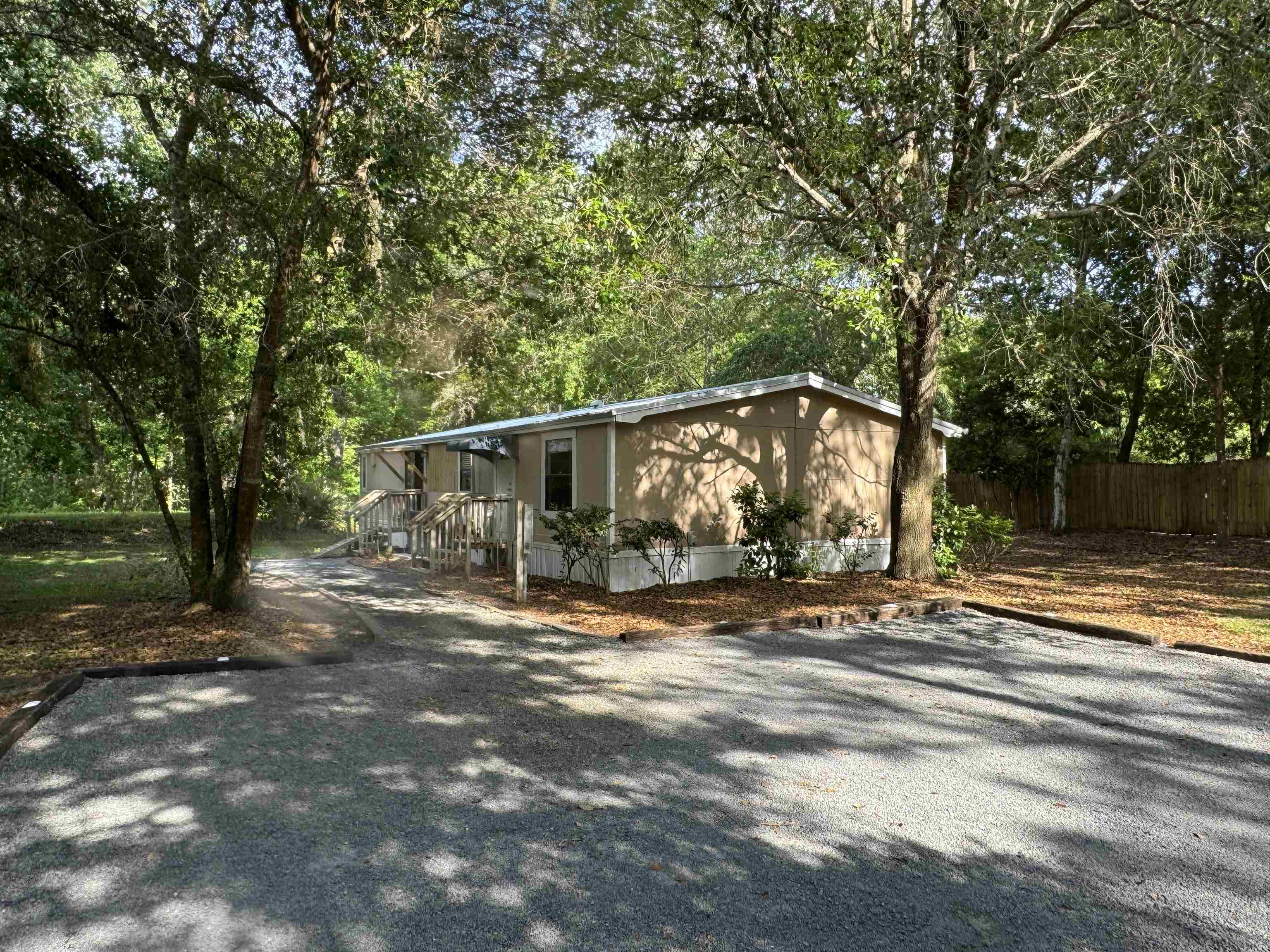 4430 Manucy Road, Unit C St. Augustine, FL 32084 - Photo 22 of 26 a view of a house with a tree in the background